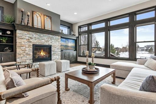Another view of living room area complete with fireplace and built-ins.
