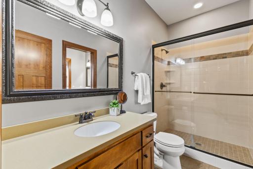 Tiled shower on other side of Jack and Jill