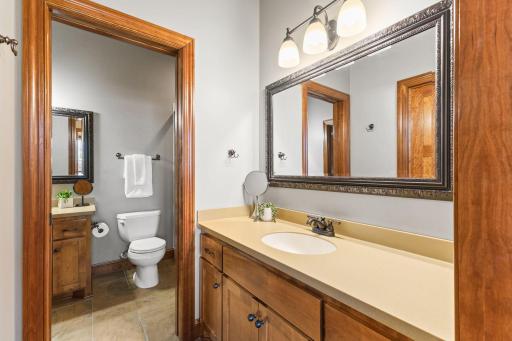 Two separate vanities with pocket door to separate the two spaces