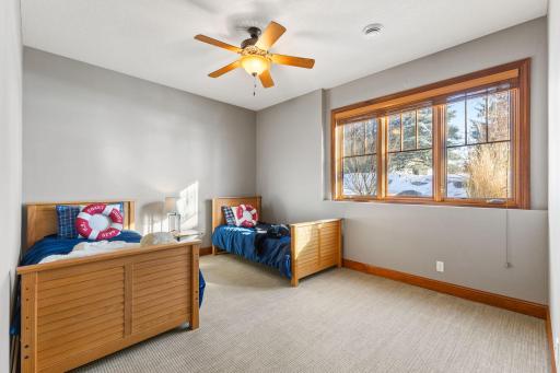 4th bedroom with walk in closet and closet organizer
