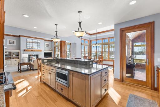 Hardwood floors and stacked crown molding. Entrance off kitchen to three season porch.