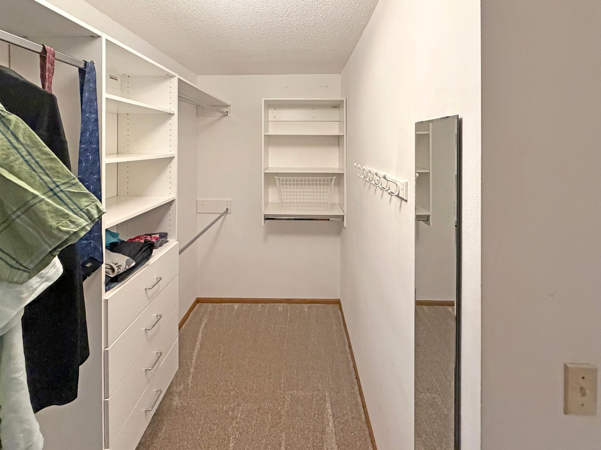 Primary walk-in closet.