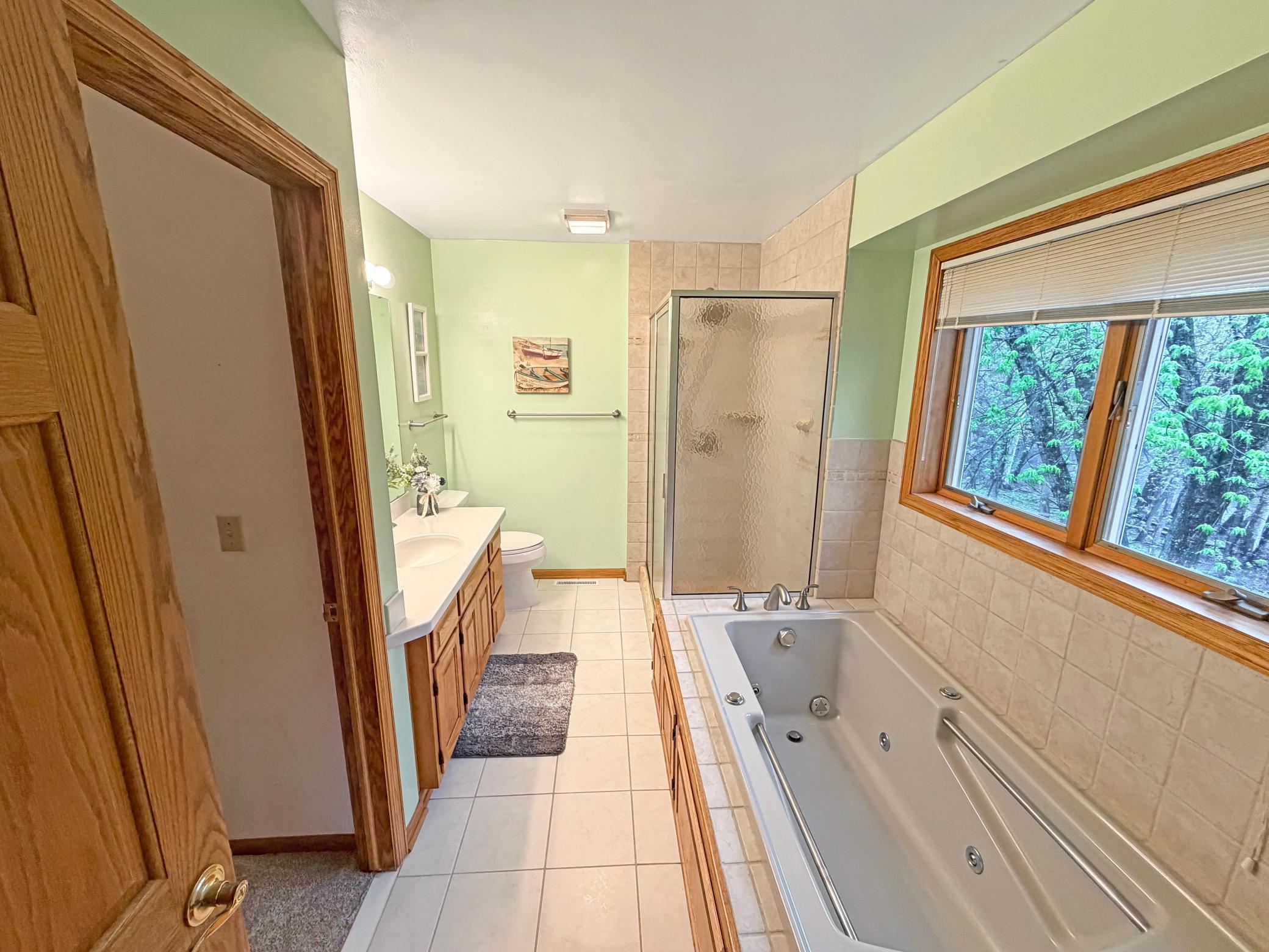 Private, primary ensuite with separate tub and shower.