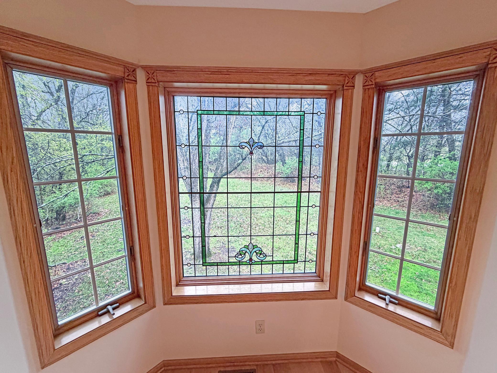 Stunning window feature overlooks your backyard.