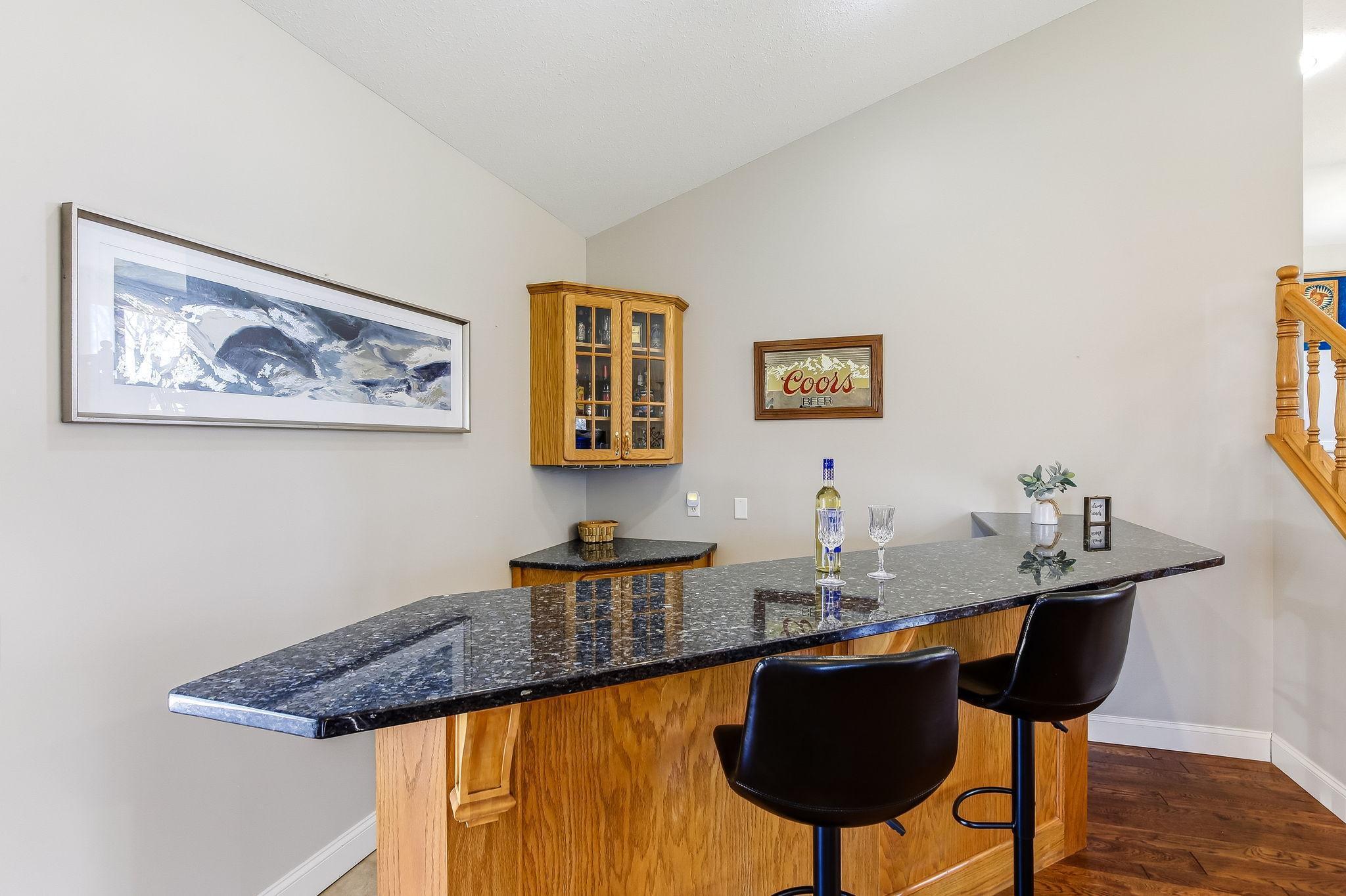 Built-in wet bar with granite countertop—perfect for entertaining.