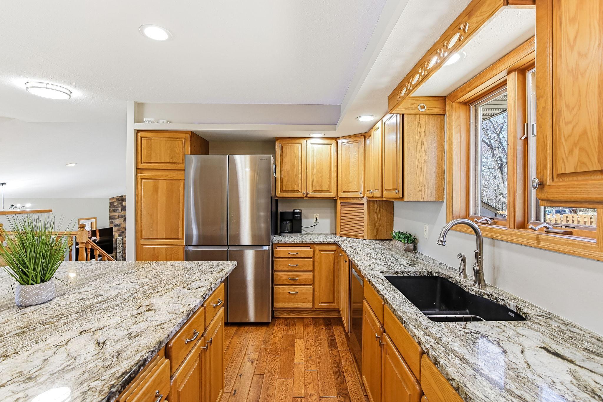 Granite counters, window over the sink, and great workspace layout.