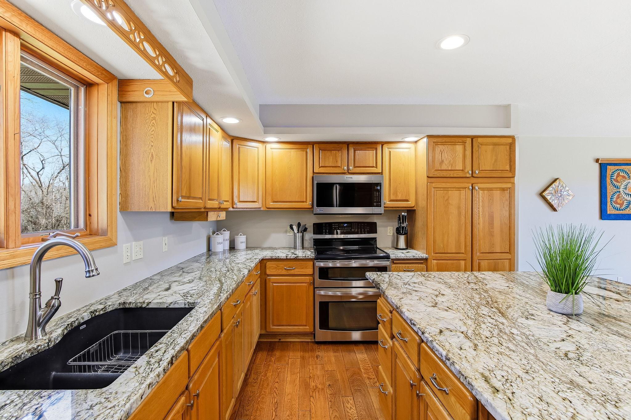 Double oven, stainless appliances, and ample prep space.