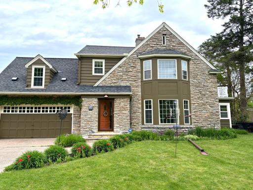 999 Nebraska Avenue West: An exquisite custom classic 1940 stone and brick home right across from Como Park!
