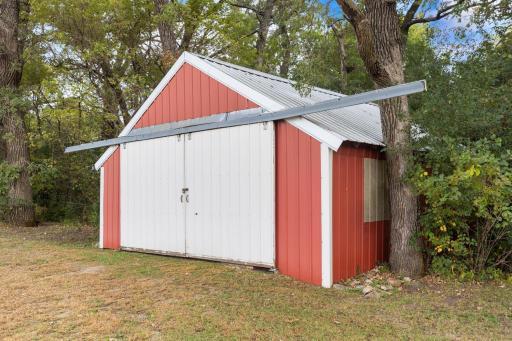 Spacious 2-stall garage, perfect for large vehicles or versatile use as a storage and workspace.