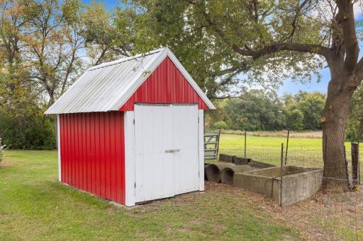 Smaller shed with new roof and siding—ideal for lawn care storage or as a shelter for small animals.