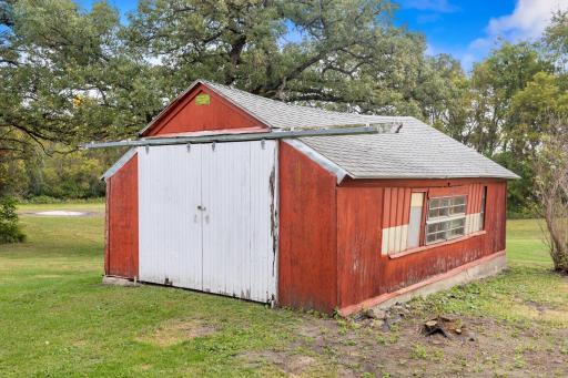 Tractor/storage shed with endless potential—use as-is or, with a little TLC, convert it into an entertaining space overlooking the north side of the property, an ideal spot for a future pond.