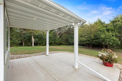 Spacious patio with built-in lighting—perfect for outdoor dining, entertaining guests, summer barbecues, or simply relaxing.