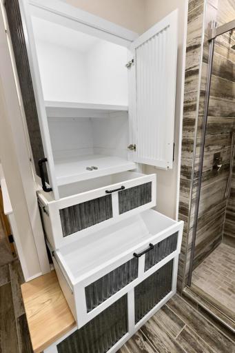 Clever built-in storage with lighting, maximizing both function and space.