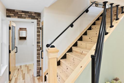 No detail was overlooked in this thoughtfully designed staircase, which includes a rail that opens to easily move large furniture up or down—an uncommon convenience in a home from the early 1900s.