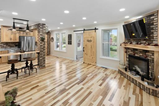 Recessed lighting enhances natural brightness, while hickory hardwood floors add warmth and character. Custom craftsmanship blends seamlessly with modern design, making this fully renewed 1900s home feel brand new.