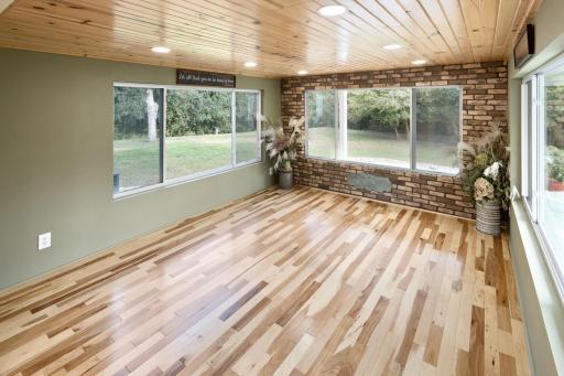 A spacious north-facing room with large windows offers the perfect place to sit and relax, or can easily be converted into a main-floor bedroom to suit your needs.