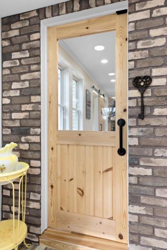 Every door was custom crafted from knotty pine, each one unique in character and design. Finished with galvanized hardware, they add rustic charm and authenticity throughout the home.