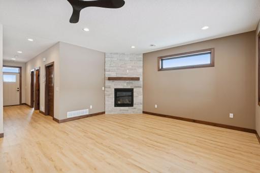 Cozy gas fire place in the family room. Open floor plans allows the kitchen and dining room to also enjoy the fireplace.