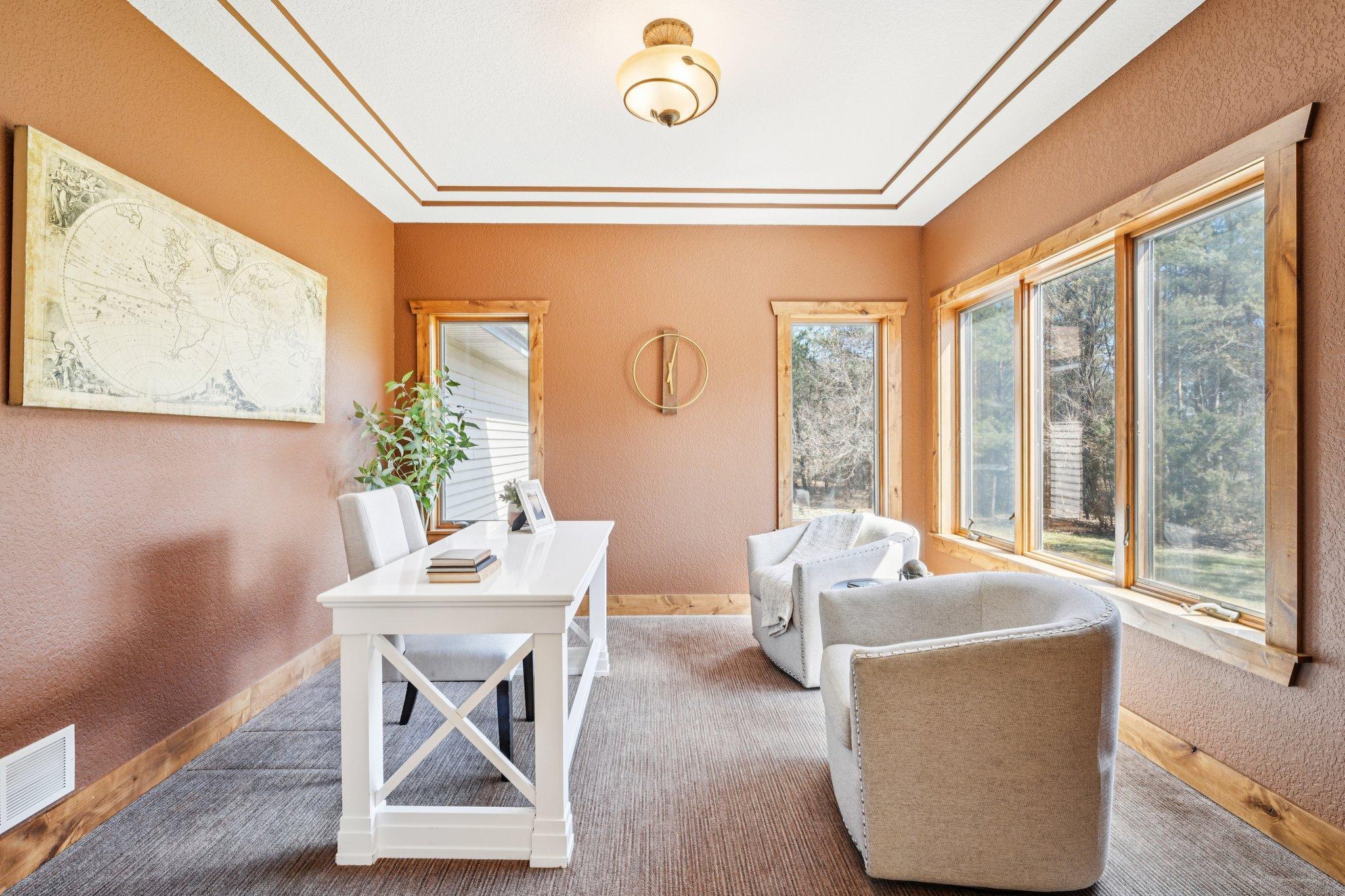 Main-floor office has huge windows and wooded views of your backyard