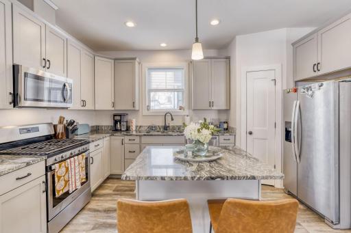 Plenty of counter space, task lighting, and natural light in the kitchen.