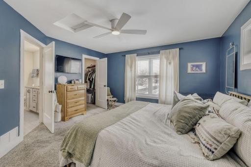 Primary bedroom is large, and has a walk in closet and access to the main bathroom.