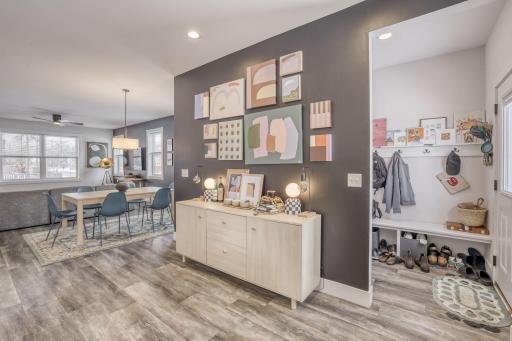 The backdoor area is off the kitchen, and offers a place to leave your shoes and bags, as you enter the home.