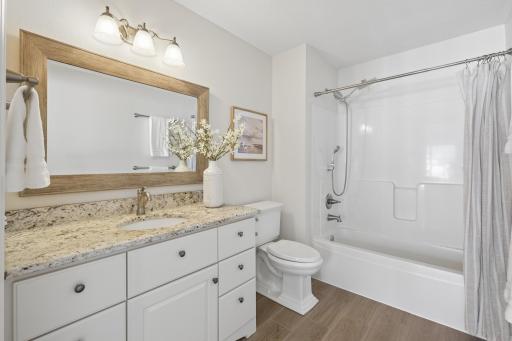 Granite countertop and soak in tub shower combo