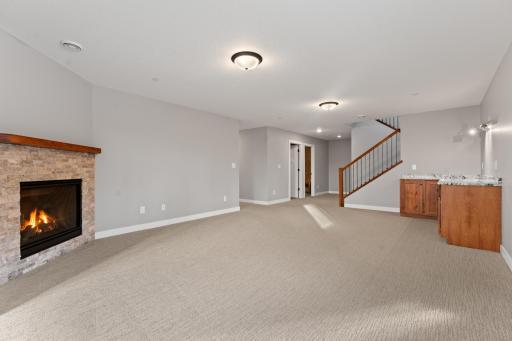 Lower level family room with gas fireplace