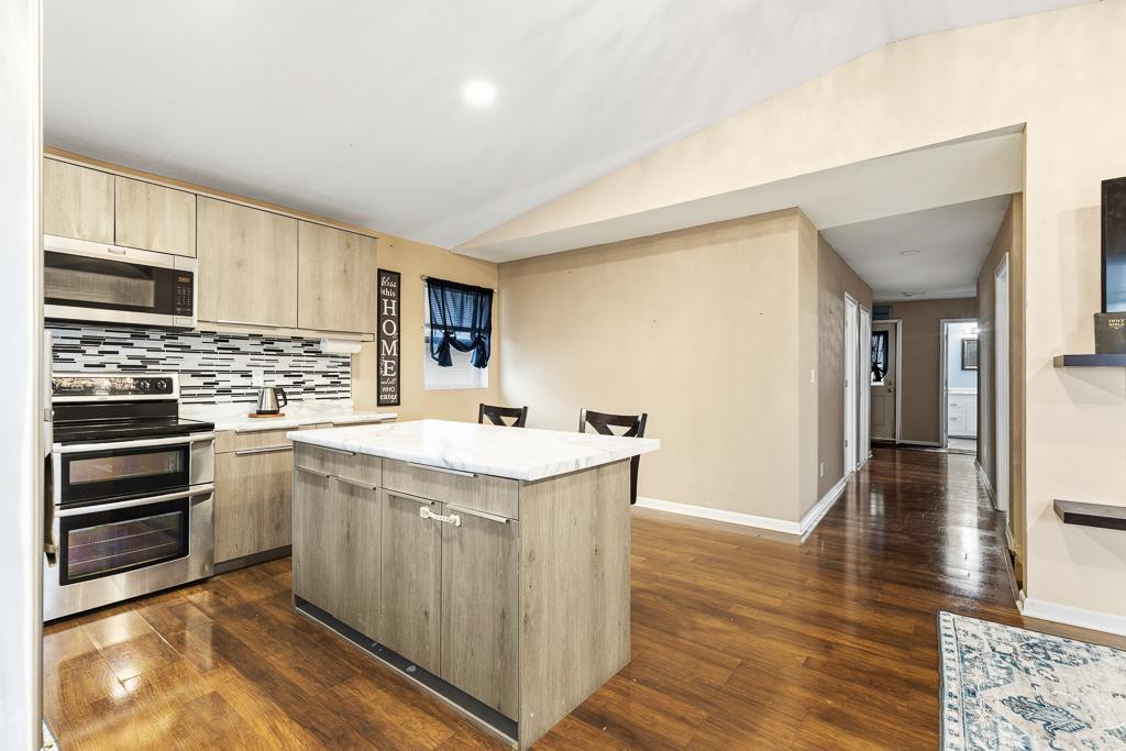 Center island adds casual seating and additional storage