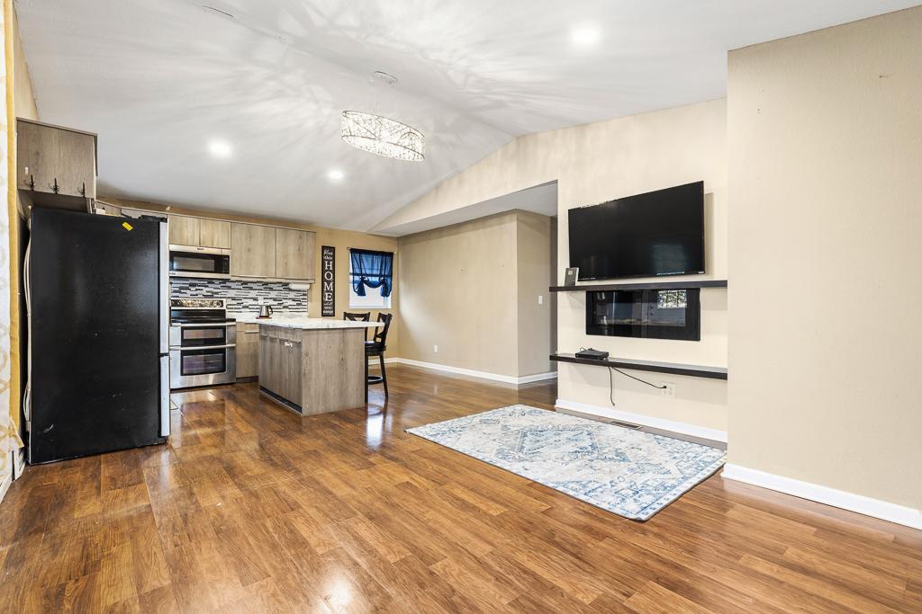 Open concept kitchen, dining, and living room