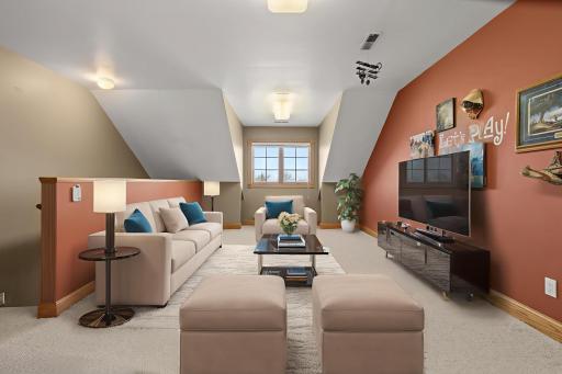 Upper level family/game room-digitally altered with staging
