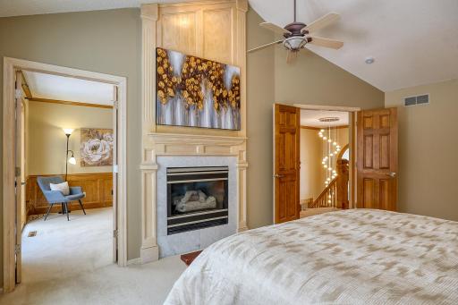 Primary Bedroom Double doors and Gas Fireplace