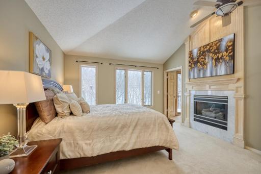 Vaulted Primary Bedroom with Gas Fireplace and Attached Room Perfect for a Nursery or Office