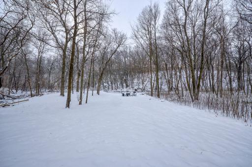This lot abuts the breathtaking Purgatory Creek Preserve Area