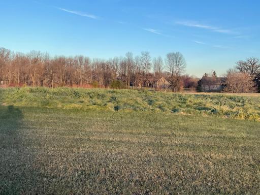 Open land stretches wide, ready for a home filled with warmth.
