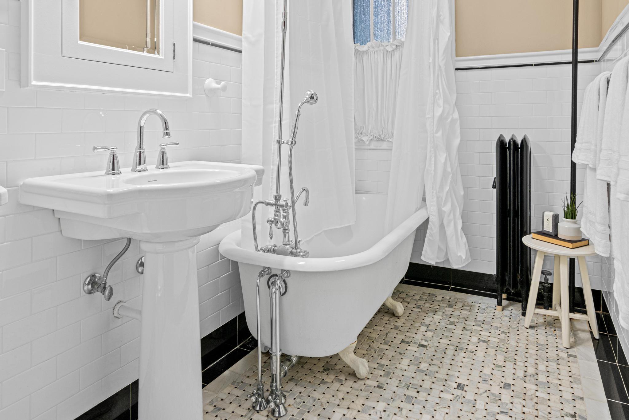 Custom tile work, updated plumbing, and restored original toilet.