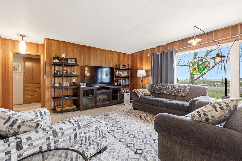 Cozy living room with large windows letting natural light fill the space