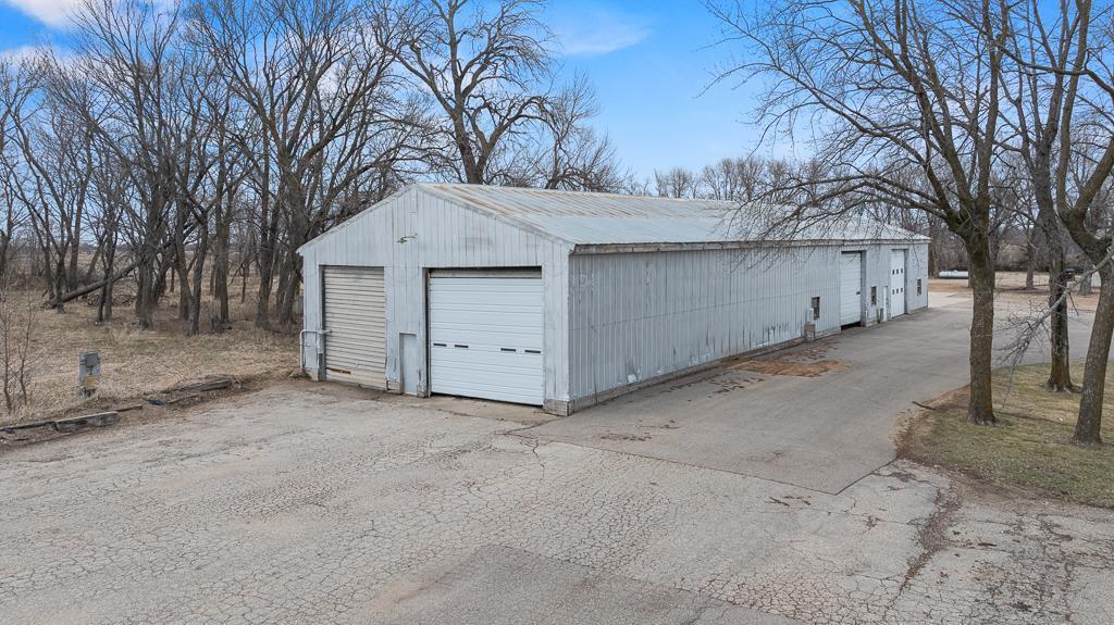 Large door on south side is broken - smaller door is 12'w x14'h