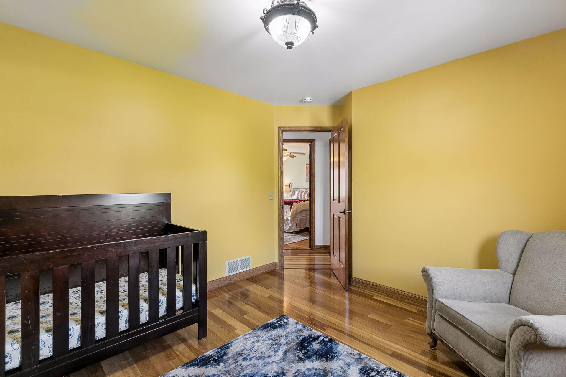 2nd bedroom with natural light, warm wood finishes and flexible space perfect for bedroom, playroom, nursery, craft room or study area.
