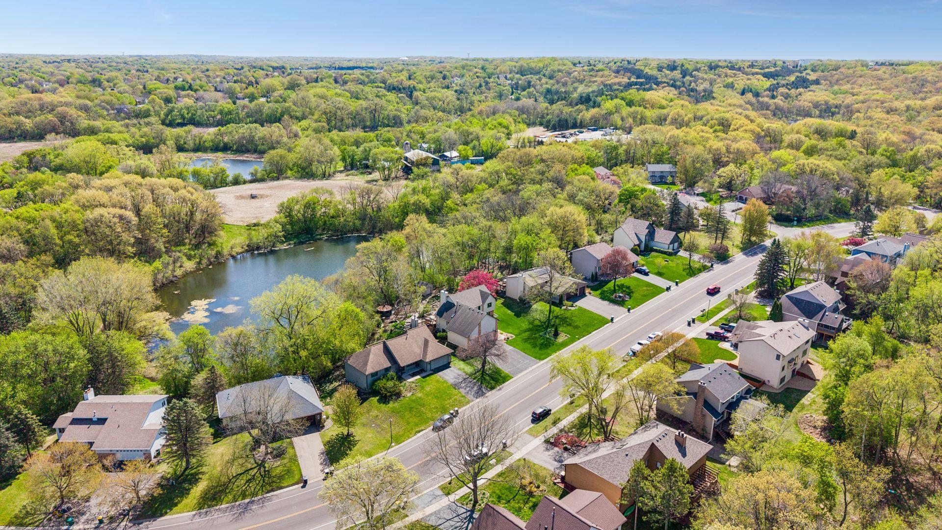 Exceptional location near scenic ponds, walking trails, parks, shopping, dining, and convenient access to major highways while still offering a peaceful natural setting.