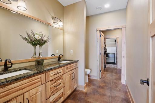Large primary bathroom with walk in closet and walk through laundry room