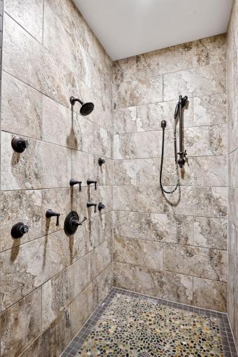 Tiled primary bath shower with 5 shower heads