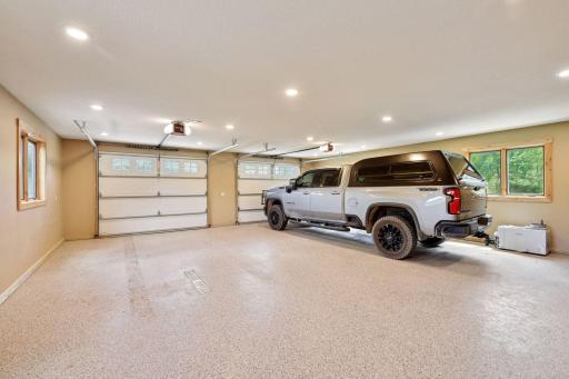 Attached 3 car garage with zero entry garage with in floor heated and epoxied floors