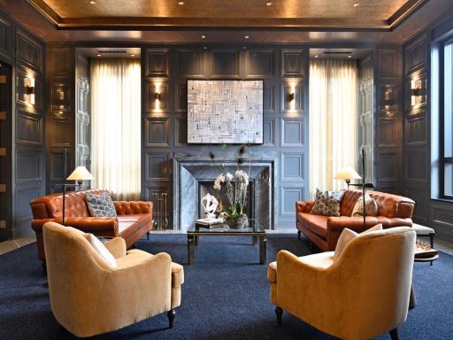 Sophisticated resident lounge with fireplace and custom finishes.
