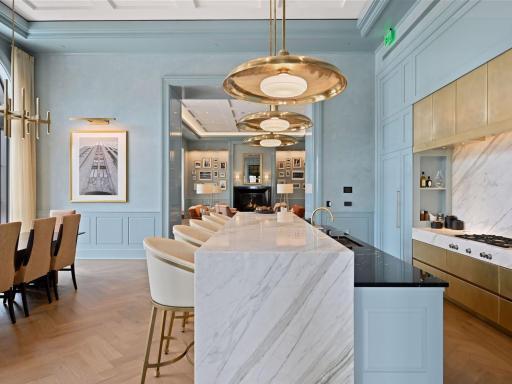 Open-concept kitchen flows seamlessly into elegant lounge areas.