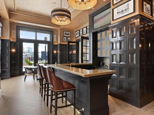 Clubroom bar with seating and direct outdoor access.