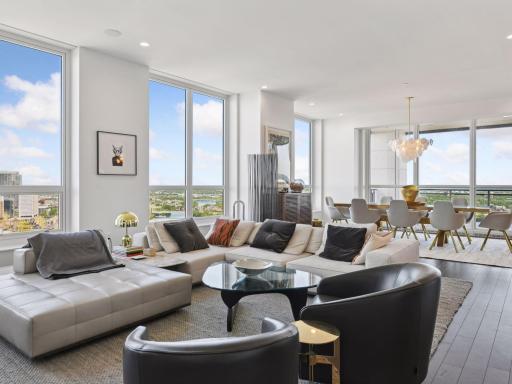 Open-concept living and dining, perfect for entertaining with panoramic city views.