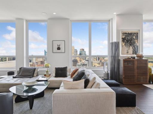 Spacious design with floor-to-ceiling windows and skyline views.