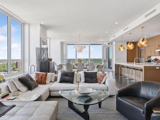 Open living and dining layout with seamless kitchen connection.