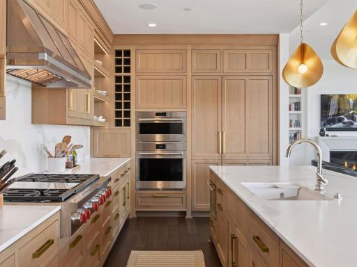 High-end appliances, custom cabinetry, and sleek quartz countertops.